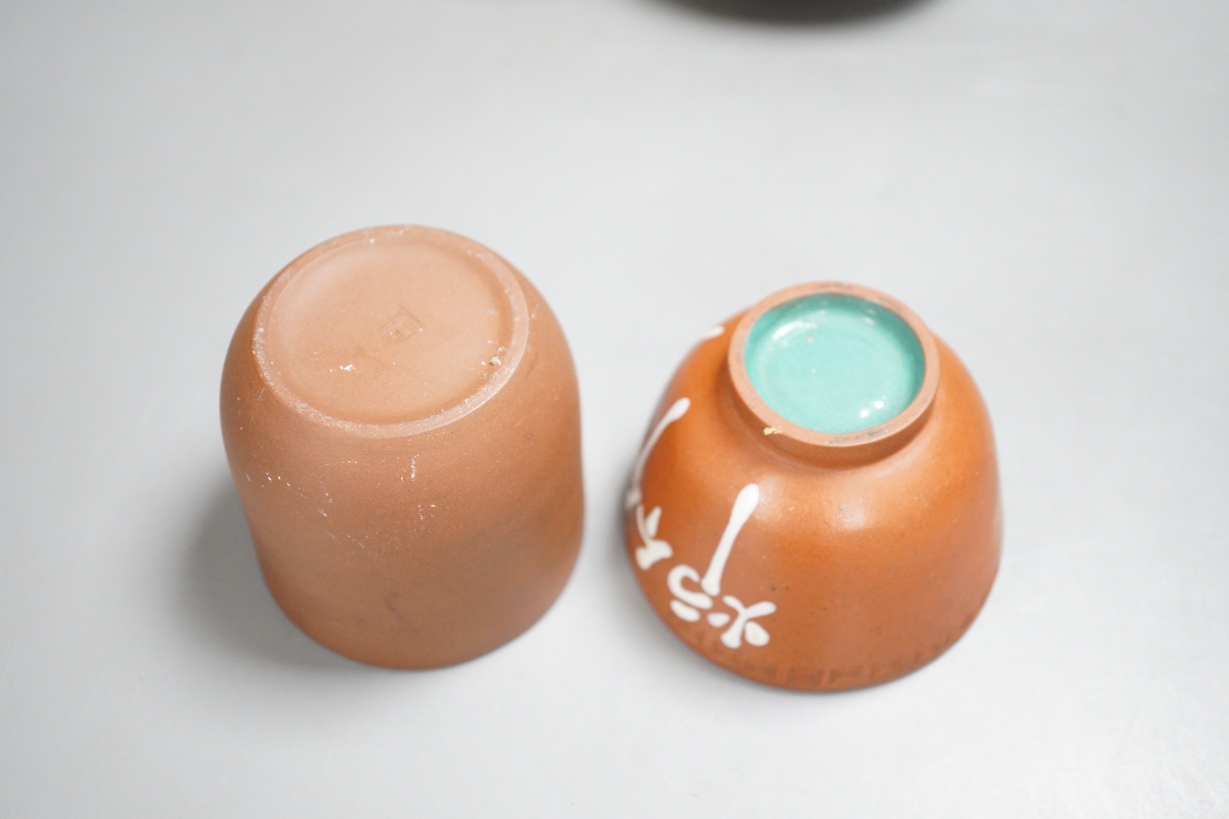 Two Chinese Yixing teapots and two similar teabowls. Tallest 14cm
